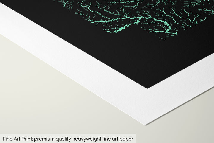 Closeup of a fine art print's corner lying on a flat surface, the details of a Grasshopper Geography map is visible. The text at the bottom reads: Fine art print - premium quality heavyweight fine art paper.