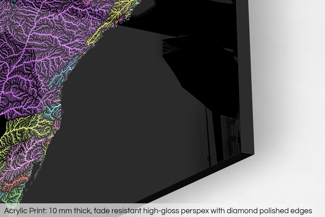 Closeup of an acrylic panel's corner, the details of a Grasshopper Geography map is visible. The text at the bottom reads: Acrylic print - 10 mm thick, fade reistant high-gloss perspex with diamond polished edges.
