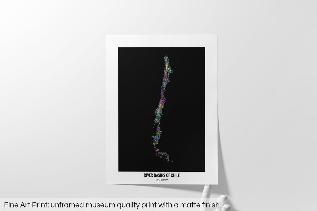Unframed fine art print of a colourful map with a thick white mat. The title of the map and the Grasshopper Geography logo is printed on the mat, below the image. The map print lies flat on a white surface, a hand holding up one of the corners. The bottom text reads: Fine art print - unframed museum quality print with a matte finish.