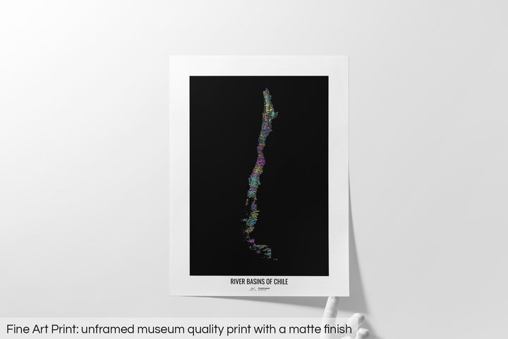 Unframed fine art print of a colourful map with a thick white mat. The title of the map and the Grasshopper Geography logo is printed on the mat, below the image. The map print lies flat on a white surface, a hand holding up one of the corners. The bottom text reads: Fine art print - unframed museum quality print with a matte finish.