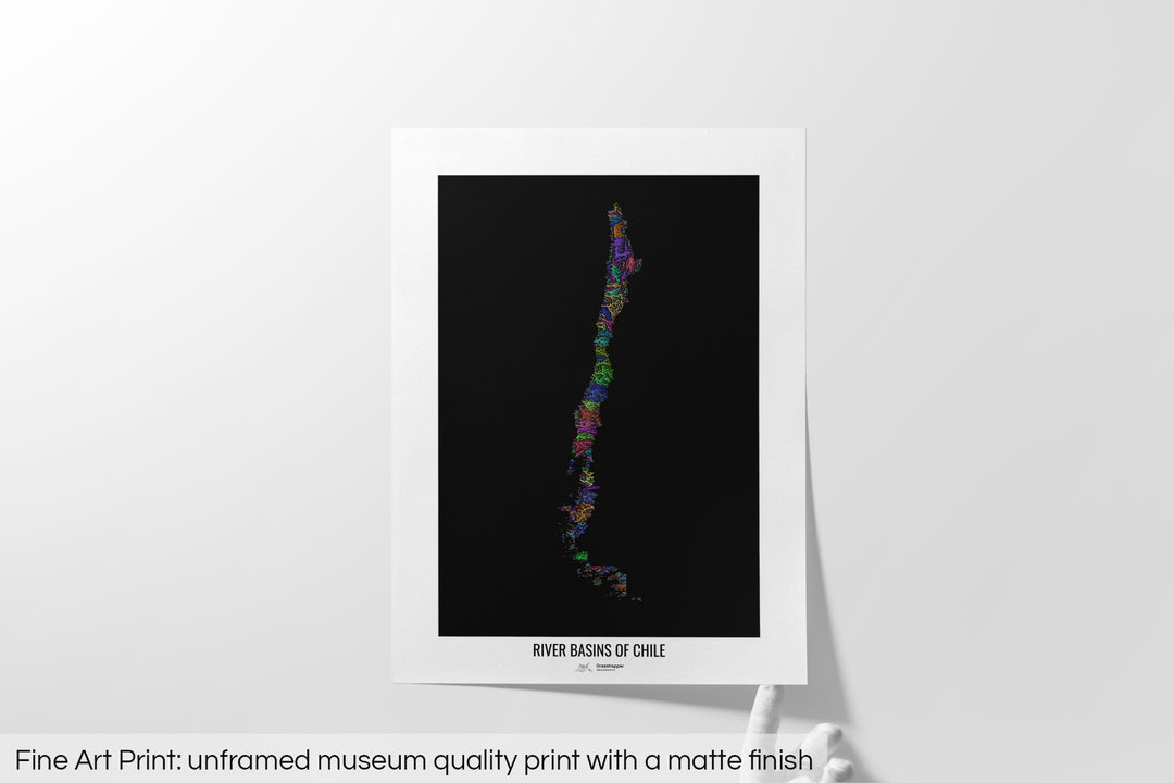 Unframed fine art print of a colourful map with a thick white mat. The title of the map and the Grasshopper Geography logo is printed on the mat, below the image. The map print lies flat on a white surface, a hand holding up one of the corners. The bottom text reads: Fine art print - unframed museum quality print with a matte finish.