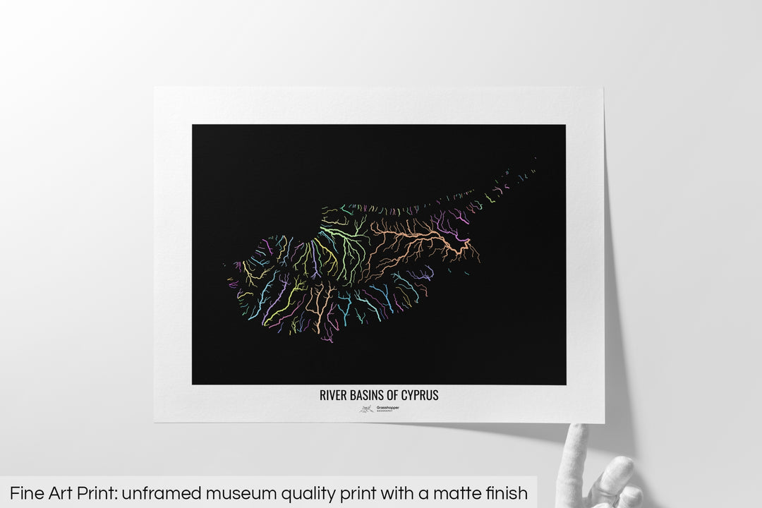 Unframed fine art print of a colourful map with a thick white mat. The title of the map and the Grasshopper Geography logo is printed on the mat, below the image. The map print lies flat on a white surface, a hand holding up one of the corners. The bottom text reads: Fine art print - unframed museum quality print with a matte finish.