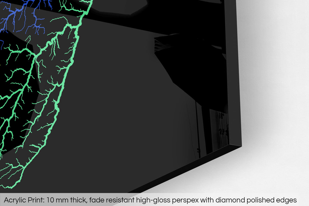 Closeup of an acrylic panel's corner, the details of a Grasshopper Geography map is visible. The text at the bottom reads: Acrylic print - 10 mm thick, fade reistant high-gloss perspex with diamond polished edges.
