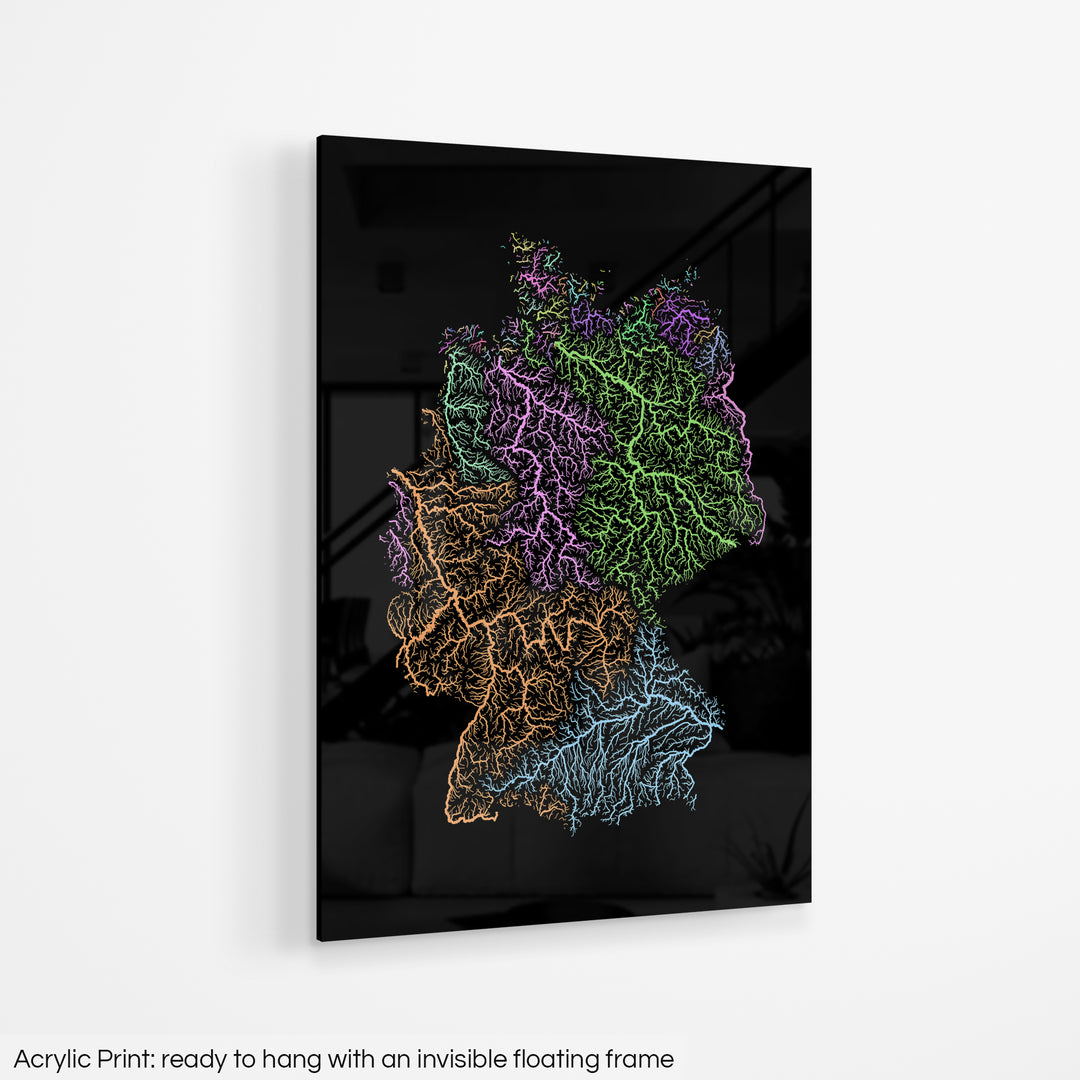 A colourful Grasshopper Geography map hanging on a white wall. The text at the bottom reads: Acrylic print - ready to hang with an invisible floating frame.