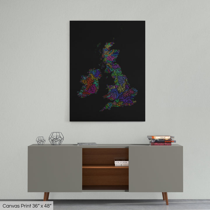 A colourful Grasshopper Geography map home decor in a living room, on a light grey wall. The map is printed on canvas and hangs above a modern low storage cabinet.