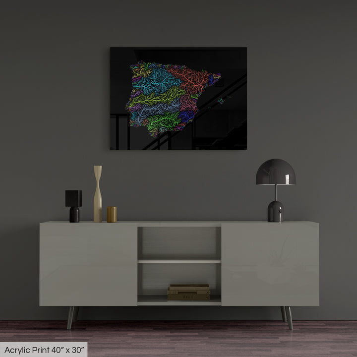 A colourful Grasshopper Geography map, home decor hanging on a grey wall in a living room. The map is printed on an acrylic panel and hangs above a modern low storage cabinet.
