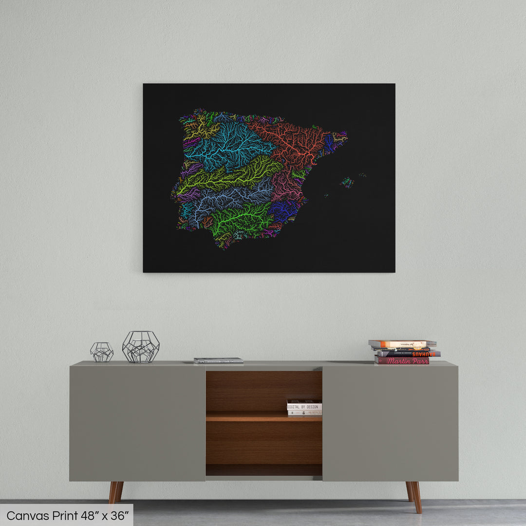 A colourful Grasshopper Geography map home decor in a living room, on a light grey wall. The map is printed on canvas and hangs above a modern low storage cabinet.