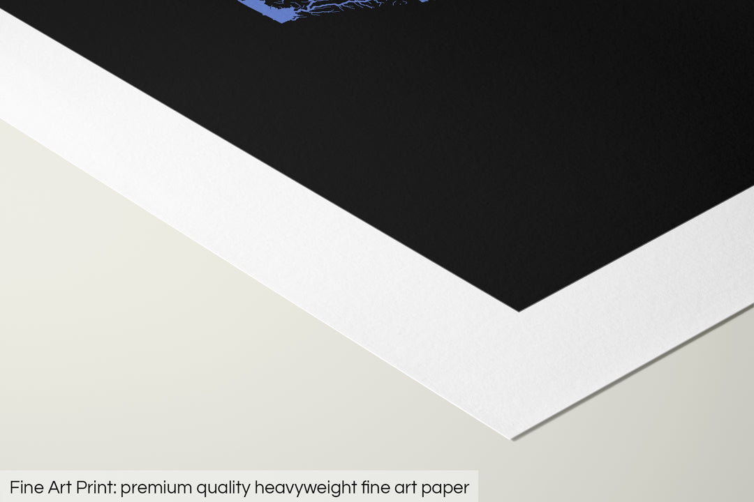 Closeup of a fine art print's corner lying on a flat surface, the details of a Grasshopper Geography map is visible. The text at the bottom reads: Fine art print - premium quality heavyweight fine art paper.