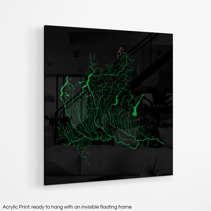 A colourful Grasshopper Geography map hanging on a white wall. The text at the bottom reads: Acrylic print - ready to hang with an invisible floating frame.