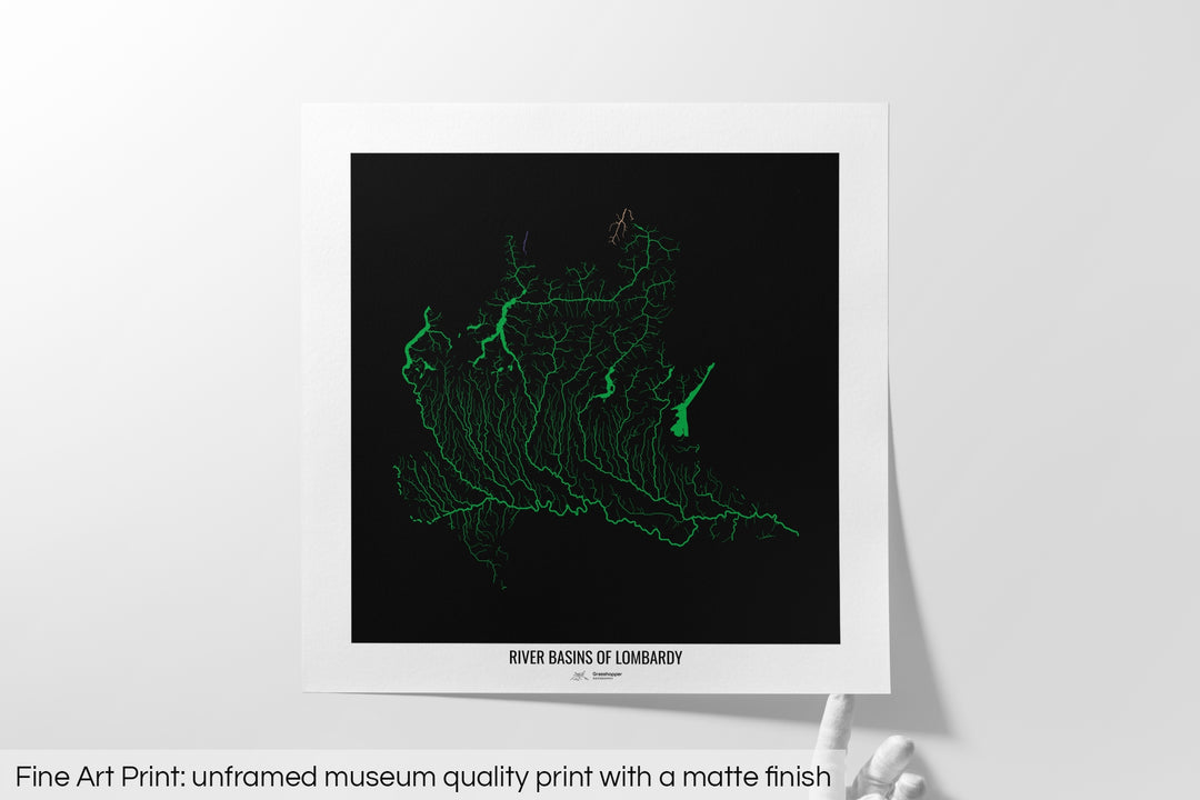 Unframed fine art print of a colourful map with a thick white mat. The title of the map and the Grasshopper Geography logo is printed on the mat, below the image. The map print lies flat on a white surface, a hand holding up one of the corners. The bottom text reads: Fine art print - unframed museum quality print with a matte finish.