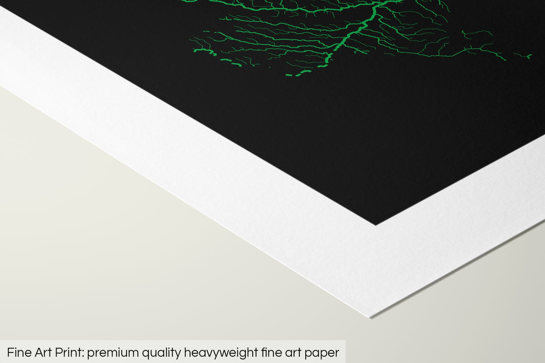 Closeup of a fine art print's corner lying on a flat surface, the details of a Grasshopper Geography map is visible. The text at the bottom reads: Fine art print - premium quality heavyweight fine art paper.