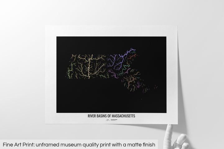 Unframed fine art print of a colourful map with a thick white mat. The title of the map and the Grasshopper Geography logo is printed on the mat, below the image. The map print lies flat on a white surface, a hand holding up one of the corners. The bottom text reads: Fine art print - unframed museum quality print with a matte finish.