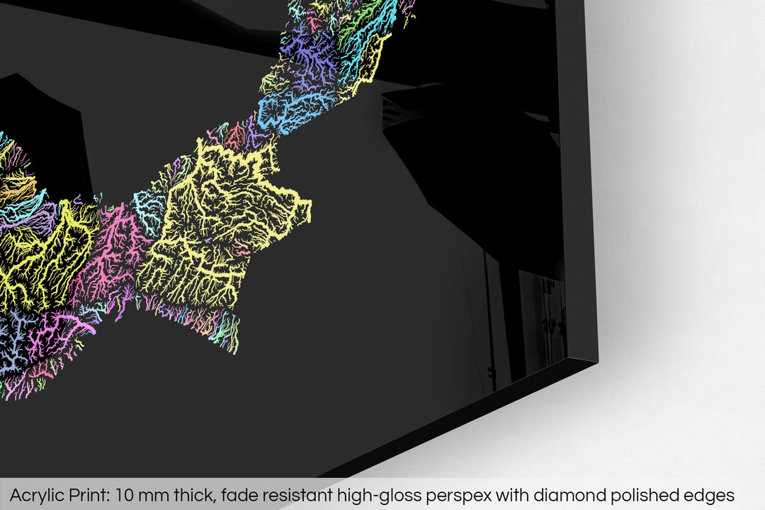 Closeup of an acrylic panel's corner, the details of a Grasshopper Geography map is visible. The text at the bottom reads: Acrylic print - 10 mm thick, fade reistant high-gloss perspex with diamond polished edges.