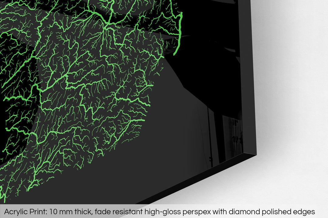 Closeup of an acrylic panel's corner, the details of a Grasshopper Geography map is visible. The text at the bottom reads: Acrylic print - 10 mm thick, fade reistant high-gloss perspex with diamond polished edges.