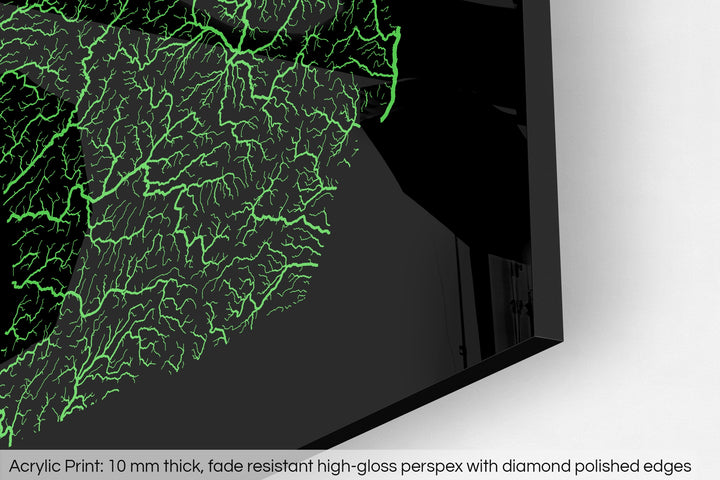 Closeup of an acrylic panel's corner, the details of a Grasshopper Geography map is visible. The text at the bottom reads: Acrylic print - 10 mm thick, fade reistant high-gloss perspex with diamond polished edges.