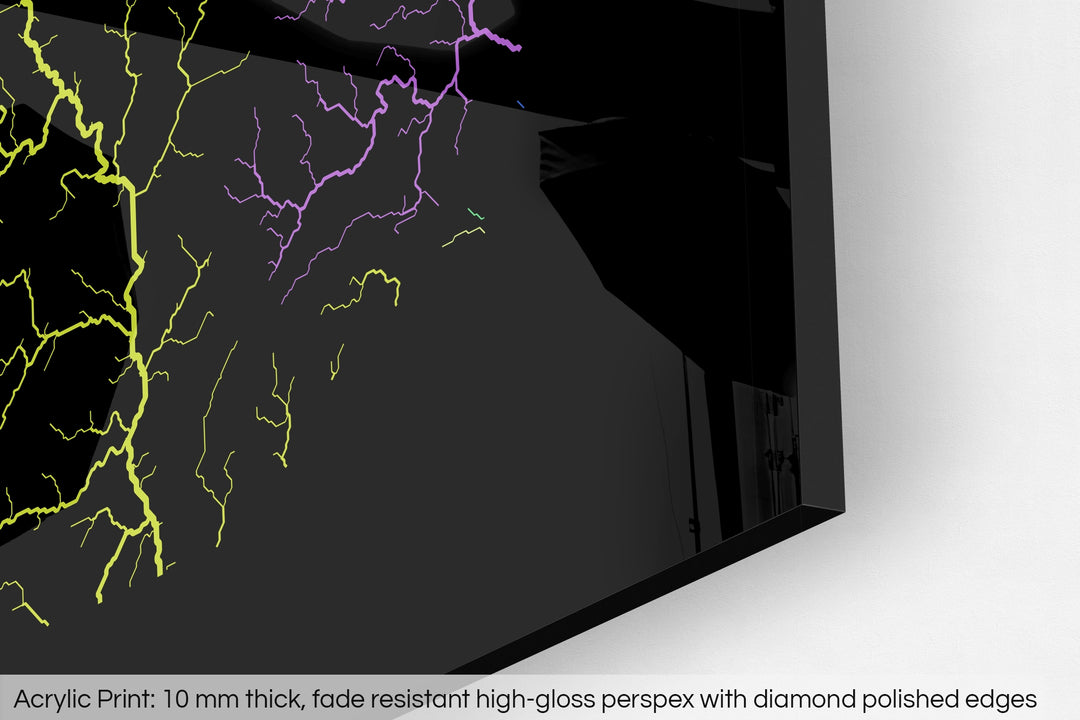 Closeup of an acrylic panel's corner, the details of a Grasshopper Geography map is visible. The text at the bottom reads: Acrylic print - 10 mm thick, fade reistant high-gloss perspex with diamond polished edges.