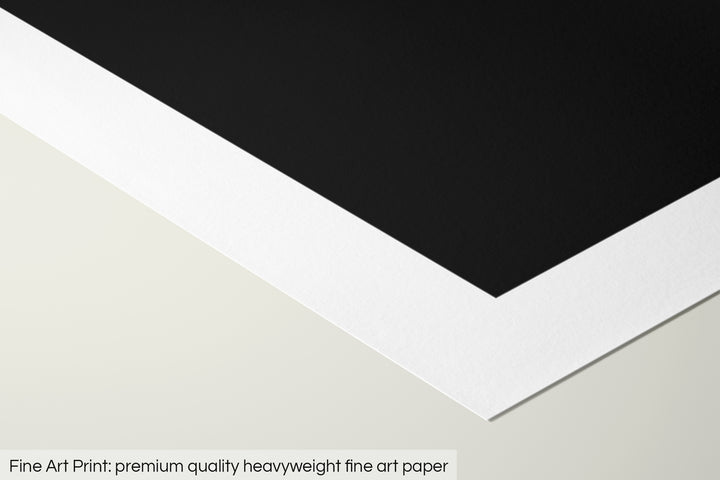 Closeup of a fine art print's corner lying on a flat surface, the details of a Grasshopper Geography map is visible. The text at the bottom reads: Fine art print - premium quality heavyweight fine art paper.