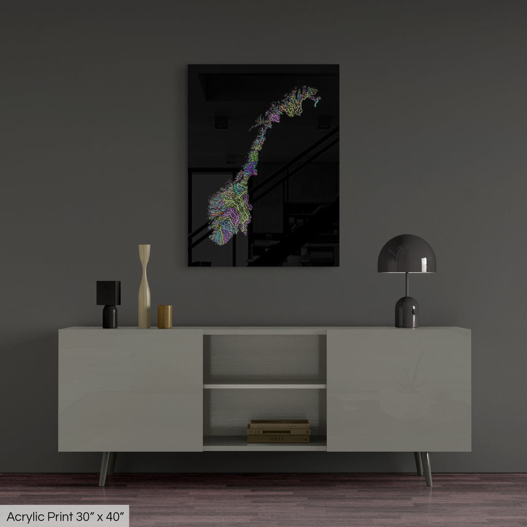 A colourful Grasshopper Geography map, home decor hanging on a grey wall in a living room. The map is printed on an acrylic panel and hangs above a modern low storage cabinet.