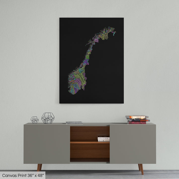 A colourful Grasshopper Geography map home decor in a living room, on a light grey wall. The map is printed on canvas and hangs above a modern low storage cabinet.