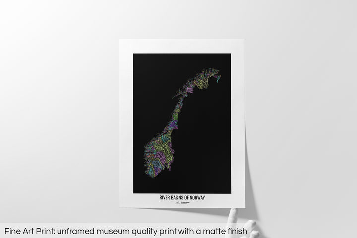 Unframed fine art print of a colourful map with a thick white mat. The title of the map and the Grasshopper Geography logo is printed on the mat, below the image. The map print lies flat on a white surface, a hand holding up one of the corners. The bottom text reads: Fine art print - unframed museum quality print with a matte finish.