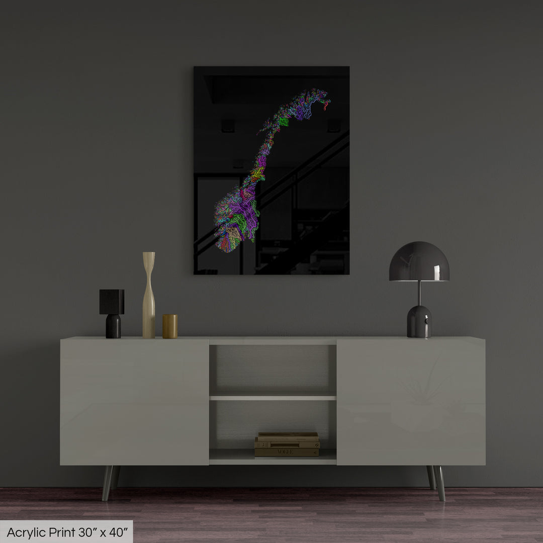A colourful Grasshopper Geography map, home decor hanging on a grey wall in a living room. The map is printed on an acrylic panel and hangs above a modern low storage cabinet.