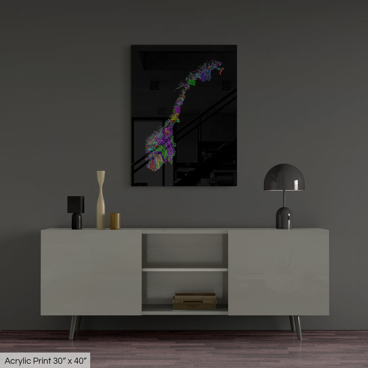 A colourful Grasshopper Geography map, home decor hanging on a grey wall in a living room. The map is printed on an acrylic panel and hangs above a modern low storage cabinet.