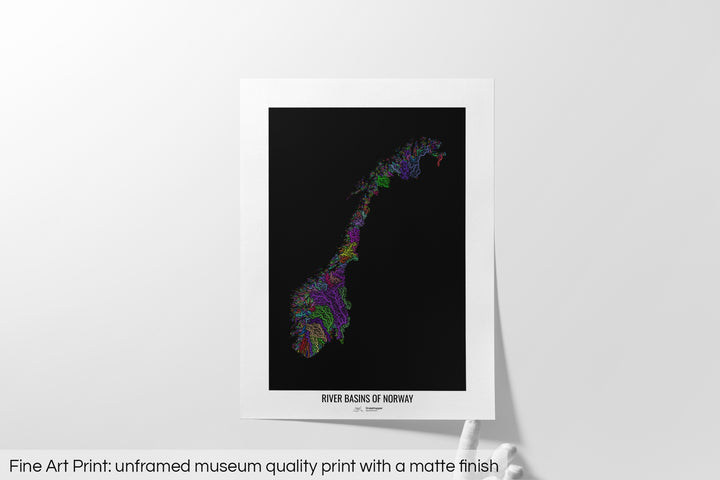 Unframed fine art print of a colourful map with a thick white mat. The title of the map and the Grasshopper Geography logo is printed on the mat, below the image. The map print lies flat on a white surface, a hand holding up one of the corners. The bottom text reads: Fine art print - unframed museum quality print with a matte finish.