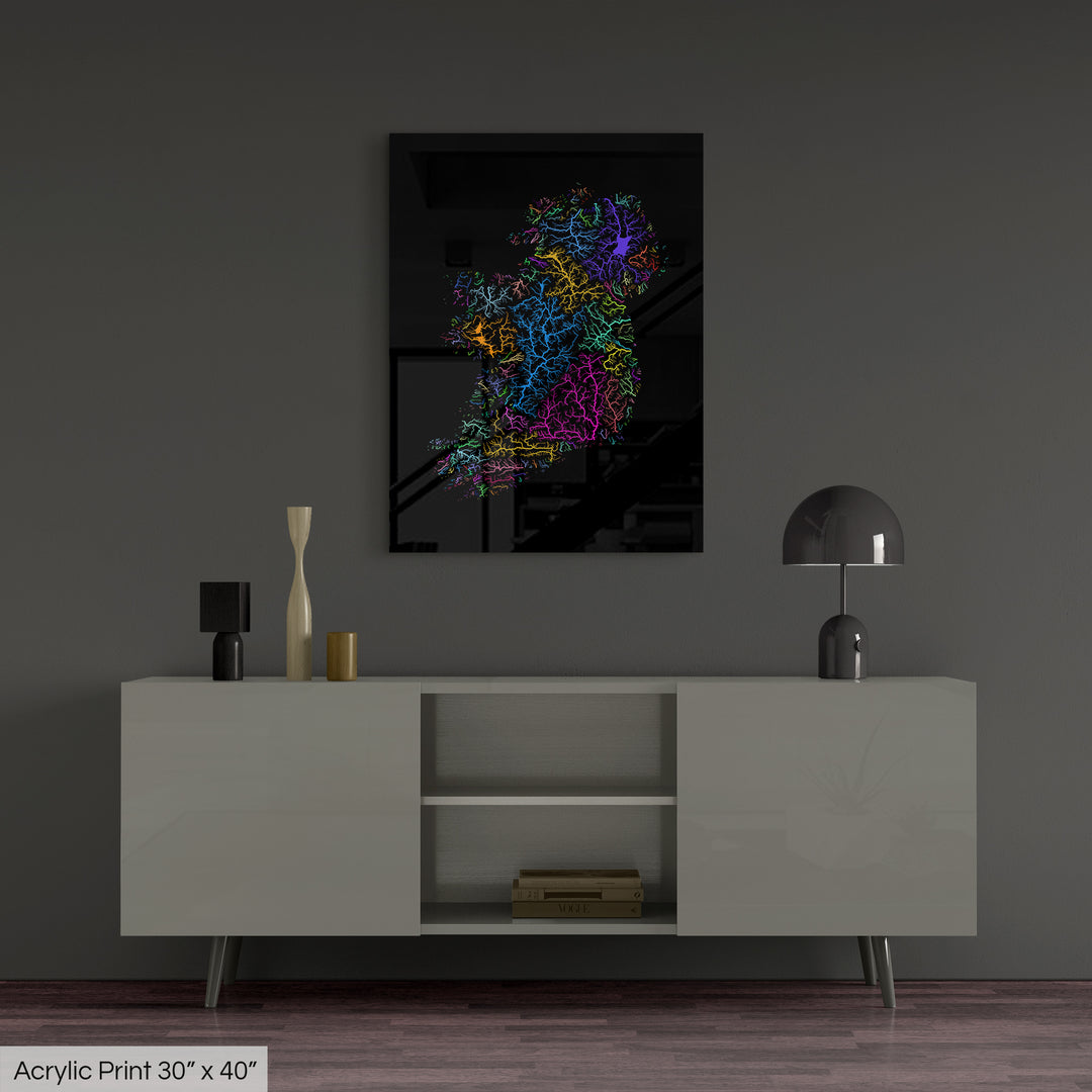 A colourful Grasshopper Geography map, home decor hanging on a grey wall in a living room. The map is printed on an acrylic panel and hangs above a modern low storage cabinet.