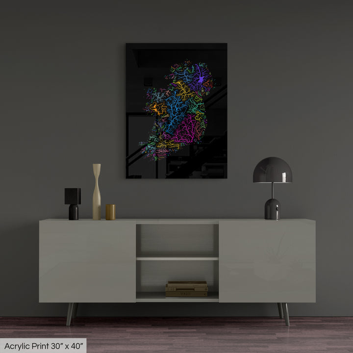 A colourful Grasshopper Geography map, home decor hanging on a grey wall in a living room. The map is printed on an acrylic panel and hangs above a modern low storage cabinet.
