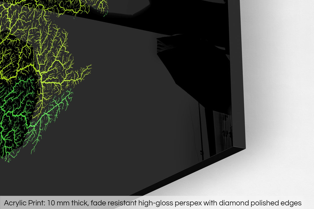 Closeup of an acrylic panel's corner, the details of a Grasshopper Geography map is visible. The text at the bottom reads: Acrylic print - 10 mm thick, fade reistant high-gloss perspex with diamond polished edges.