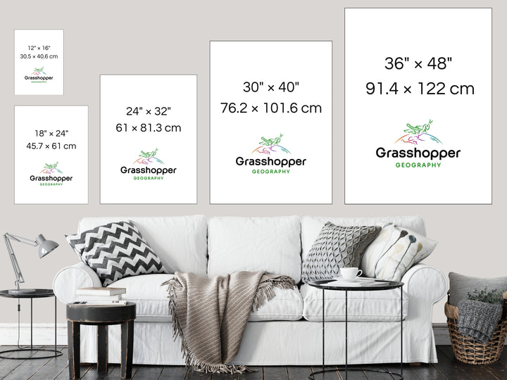 The most popular print sizes Grasshopper Geography maps are available in, lined up above a sofa on a grey wall in a sitting room.