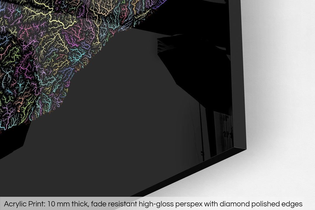 Closeup of an acrylic panel's corner, the details of a Grasshopper Geography map is visible. The text at the bottom reads: Acrylic print - 10 mm thick, fade reistant high-gloss perspex with diamond polished edges.